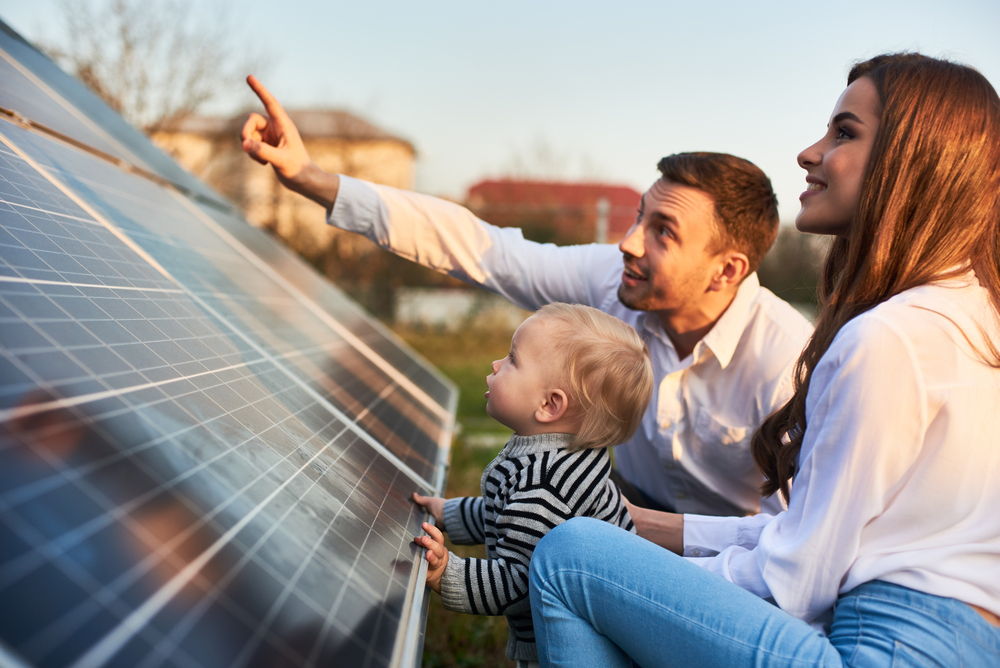 Man,Shows,His,Family,The,Solar,Panels,On,The,Plot